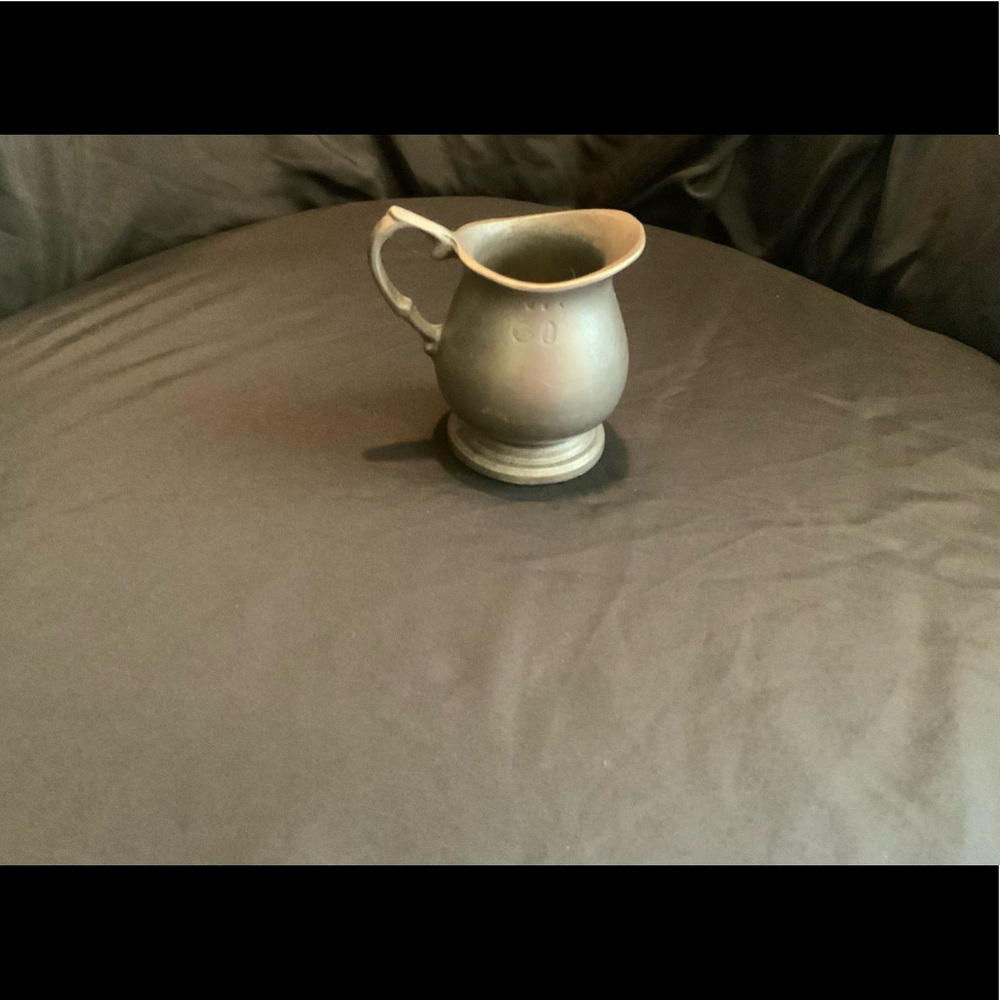 Vintage from the 1960s

Beautiful small pewter pitcher in the Old Colonial style